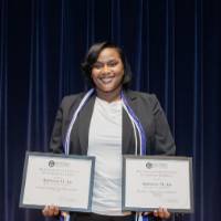 RaShawny with her two certificates